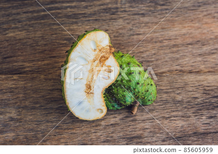 Guanabana on an old wooden background - exotic tropical fruit - regional fruits from Vietnam Guanabana on an old wooden background - exotic tropical fruit - regional fruits from Vietnam 85605959
