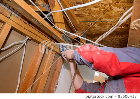 Home Interior damage for drywall board with repair home of man cutting plasterboard on using angle hand electric power tools Home Interior damage for drywall board with repair home of man cutting plasterboard on using angle hand electric power tools 85606418