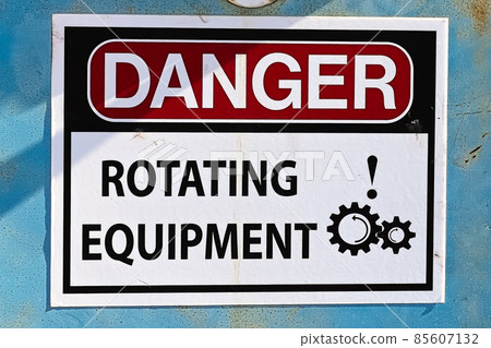 Closeup of a Danger Rotating Equipment sign Closeup of a Danger Rotating Equipment sign 85607132