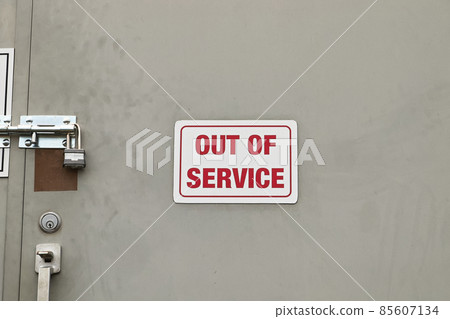 A white Out of Service Sign on a locked door A white Out of Service Sign on a locked door 85607134