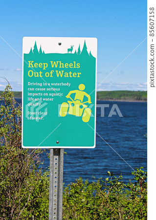 Keep wheels out of water sign along a lakeshore 85607158