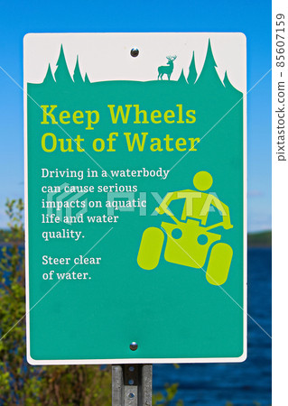 Keep wheels out of water sign along a lakeshore 85607159