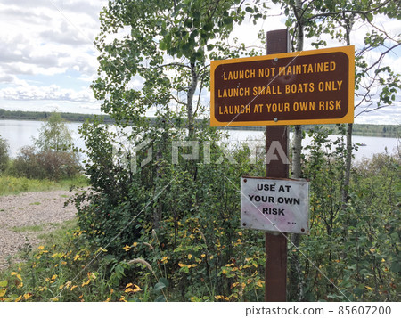 Small Unmaintained Boat Launch with Warning Signs Small Unmaintained Boat Launch with Warning Signs 85607200