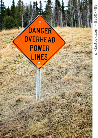 Danger overhead powerline sign in the country 85607489