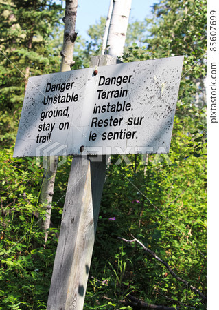Danger unstable ground, stay on trail sign Danger unstable ground, stay on trail sign 85607699