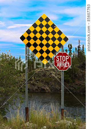 A checkered no entry and stop sign in both english and french 85607763