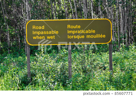 A bilingual road impassable when wet sign 85607771