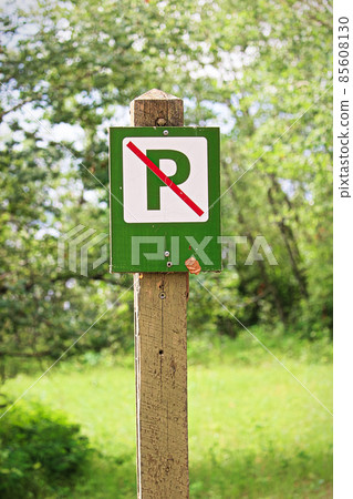 Closeup of a green no parking sign Closeup of a green no parking sign 85608130