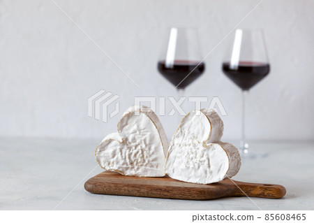 Soft heart shaped cheese and red wine glasses, Valentine Day concept 85608465