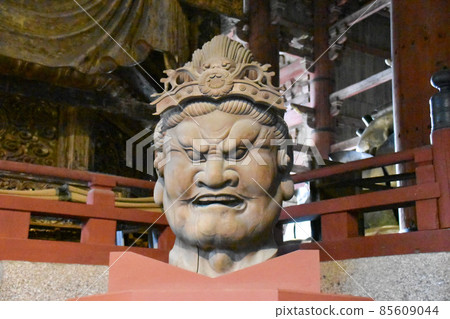 A scary face statue of Mochikokuten inside the Great Buddha Hall of Todaiji Temple A scary face statue of Mochikokuten inside the Great Buddha Hall of Todaiji Temple 85609044