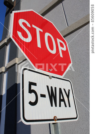 Five Way Stop Sign Beside Building Five Way Stop Sign Beside Building 85609058