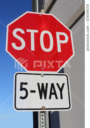 Five Way Stop Sign Beside Building Five Way Stop Sign Beside Building 85609059