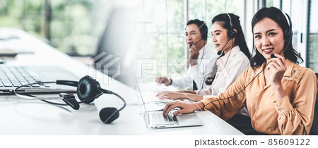 Business team wearing headset working actively in office Business team wearing headset working actively in office 85609122