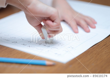 A girl in the lower grades doing homework A girl in the lower grades doing homework 85610174