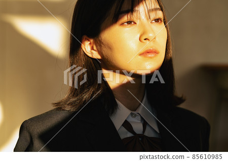 High school girl bathing in the setting sun 85610985