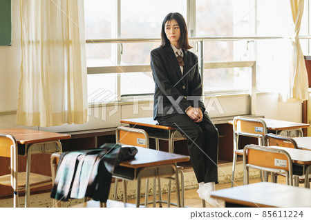 High school girl wearing slacks 85611224