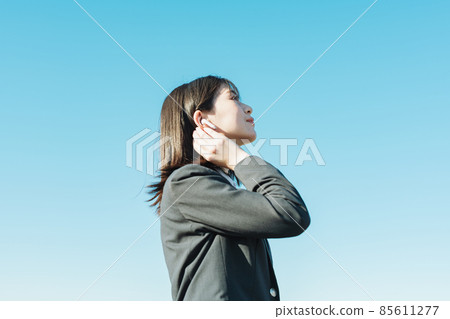 High school girl listening to music with earphones 85611277