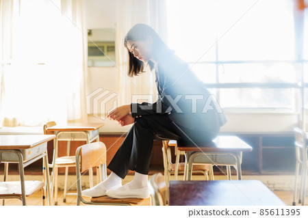 High school girl wearing a genderless uniform 85611395
