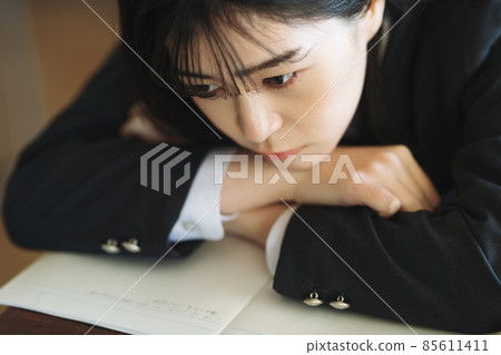 School girls lying on the desk 85611411