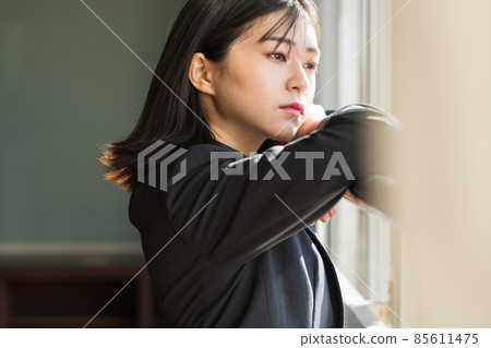 High school girl pensive in the classroom 85611475