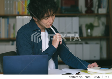 A man doing research A man doing research 85611955