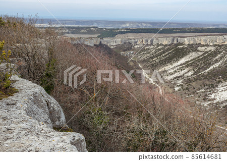 View of valley and mountain Besh-Kosh from plateau Burunchak near cavetown Chufut-Kale. Bakhchysarai, Crimea View of valley and mountain Besh-Kosh from plateau Burunchak near cavetown Chufut-Kale. Bakhchysarai, Crimea 85614681