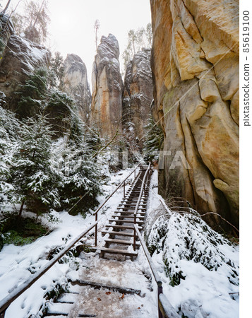 Ladder, wooden staircase and steel banister in Sandstone rocky labyrinth 85619100