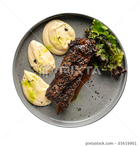 Isolated beef pepper steak with celery puree Isolated beef pepper steak with celery puree 85619901