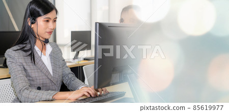 Business people wearing headset working in office broaden view Business people wearing headset working in office broaden view 85619977