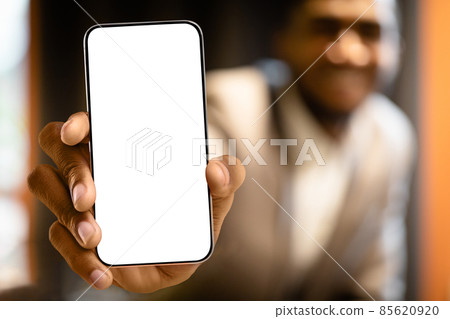 Great offer. Black man showing mew modern smartphone with big white blank screen for app or website design, mockup 85620920