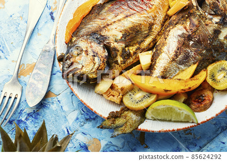 Baked grilled fish in fruit. Baked grilled fish in fruit. 85624292