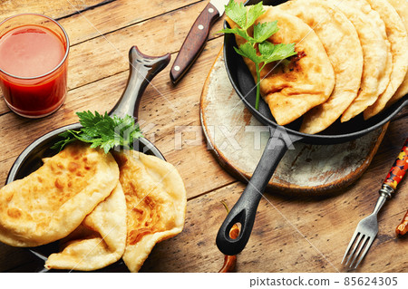 Non-yeast dough pies with meat filling 85624305