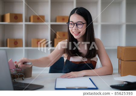 Asian small business owner working at home office. Business retail market and online sell marketing delivery, SME e-commerce concept. 85625393