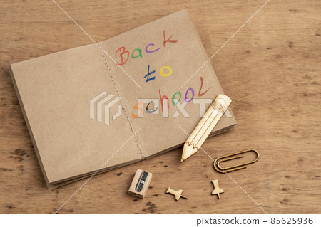 back to school template with a notebook on wooden table back to school template with a notebook on wooden table 85625936