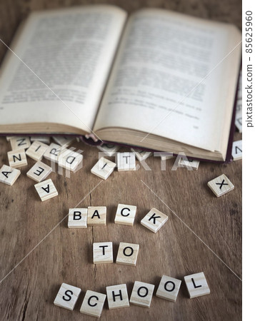 back to school template with cube letters and book 85625960