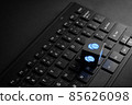 Contact us business icon on black computer keyboard with glow in the dark 85626098