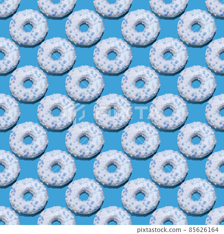seamless donut pattern with a shadow on a blue background seamless donut pattern with a shadow on a blue background 85626164