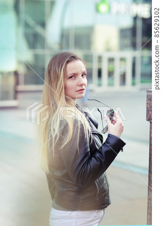 young blond slavic woman with long hair street portrait with glasses on shaping mall background young blond slavic woman with long hair street portrait with glasses on shaping mall background 85629102