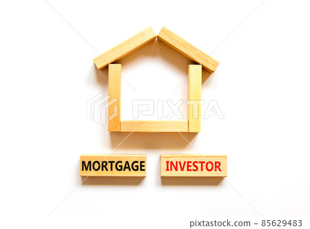 Mortgage investor symbol. Concept words 'Mortgage investor' on wooden blocks near miniature wooden house. Beautiful white background. Business, mortgage investor concept. Mortgage investor symbol. Concept words 'Mortgage investor' on wooden blocks near miniature wooden house. Beautiful white background. Business, mortgage investor concept. 85629483