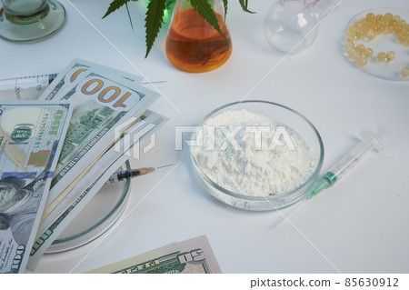 Dollars and Cocaine Flour in Glass Petri Dish on a Lab desk Dollars and Cocaine Flour in Glass Petri Dish on a Lab desk 85630912