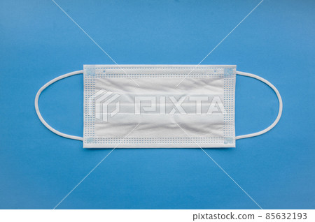 Medical mask isolated on background. Close-up of Coronavirus or COVID-19 protective face mask. Workwear prevents entry of Alpha, Beta, Gamma, Delta, Omicron into a body. Travel rules tightened over  85632193