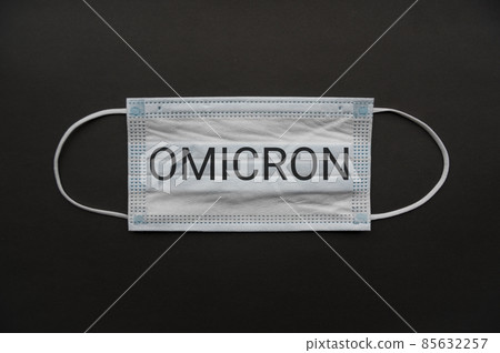 Medical mask isolated on background. Close-up of Coronavirus or COVID-19 protective face mask. Workwear prevents entry of Alpha, Beta, Gamma, Delta, Omicron into a body. Travel rules tightened over  85632257