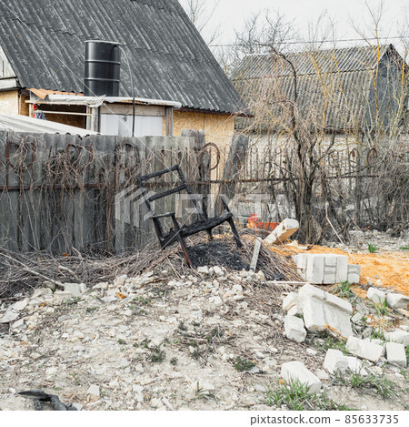Burnt chair, similar to the throne, standing on a pile of construction debris Burnt chair, similar to the throne, standing on a pile of construction debris 85633735