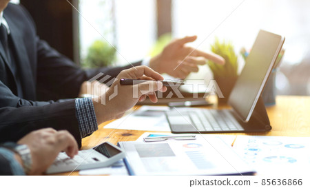 Male bankers analysing financial data together. 85636866