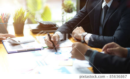 Two of businessmen working on financial data report together Two of businessmen working on financial data report together 85636867