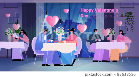 loving people celebrating happy valentines day men women in love drinking coffee in cafe horizontal 85638556