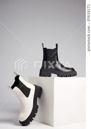 black and white boots. fashion shoes still life 85639271