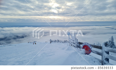 Ski or snowboard on chairlift at Big White Resort, 85639333