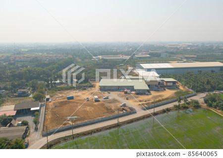 Aerial top view of dry ground rough cracks in the land with sand in factory industry for construction site. Arid pattern texture background. Aerial top view of dry ground rough cracks in the land with sand in factory industry for construction site. Arid pattern texture background. 85640065