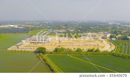 Aerial top view of dry ground rough cracks in the land with sand in factory industry for construction site. Arid pattern texture background. Aerial top view of dry ground rough cracks in the land with sand in factory industry for construction site. Arid pattern texture background. 85640070